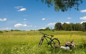 Man relaxing near  bicycle at nature